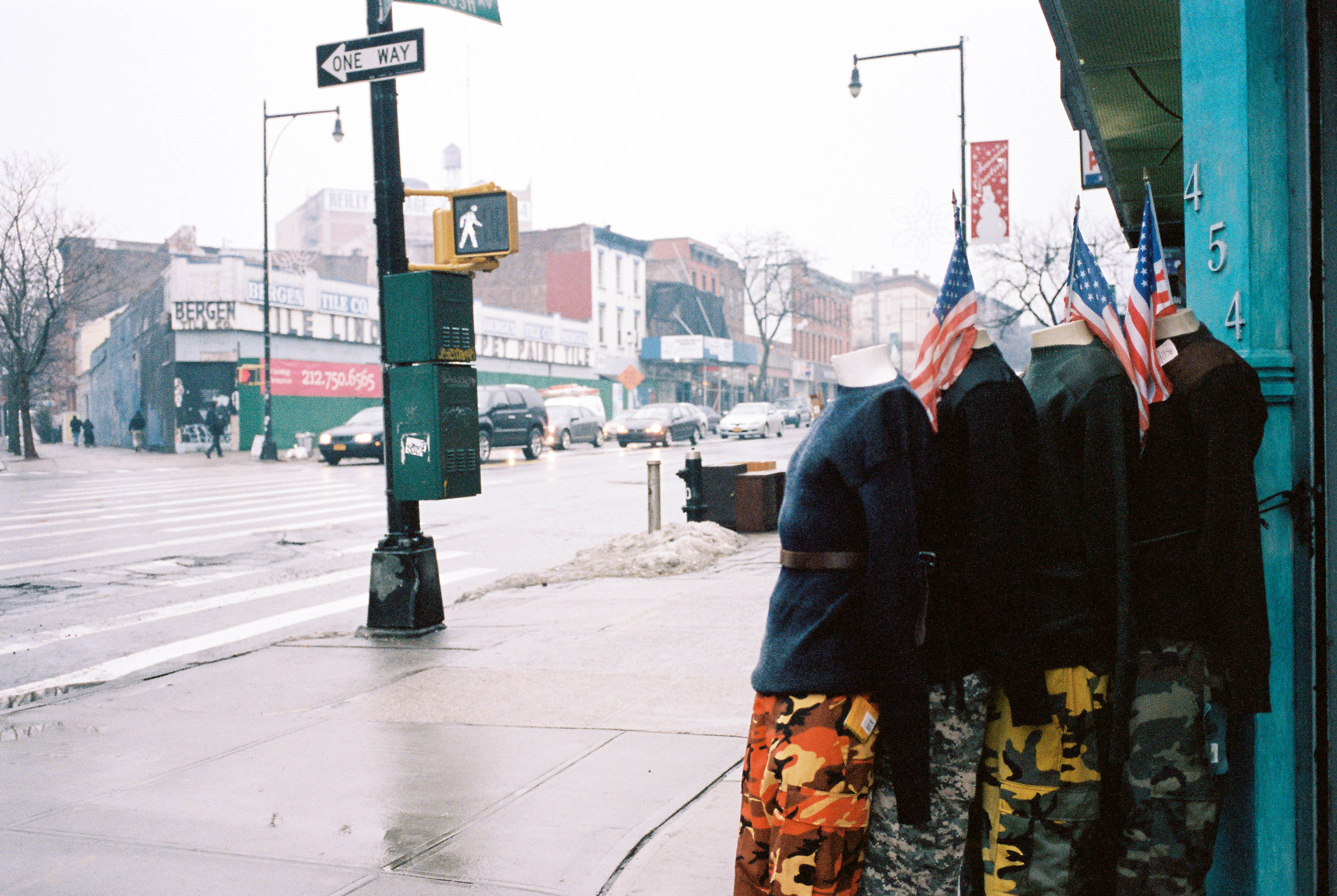 Mannequins stacked outside of a New York City shop on a January day