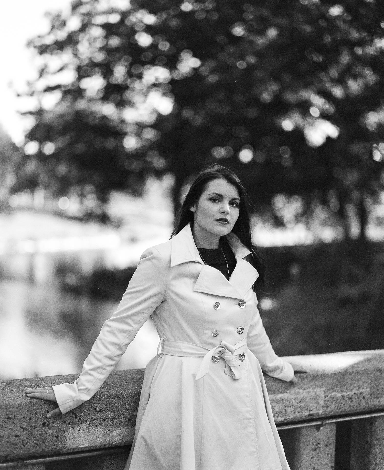 Whitney leaning against the bridge at Deering Oaks Park