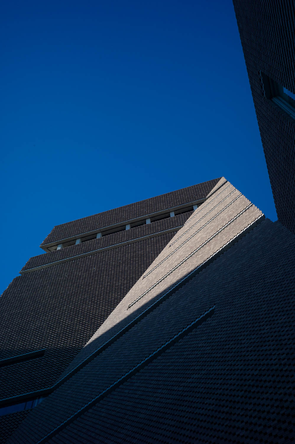 A triangle of sunlight fills a creased building at the Tate Modern museum