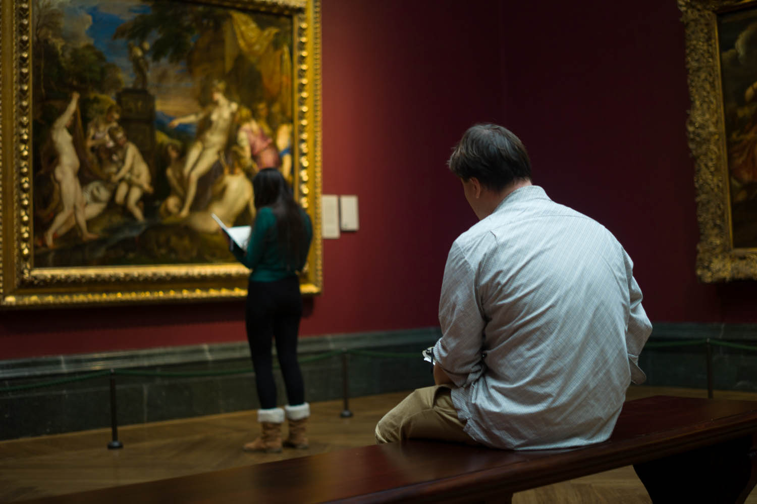 Some artists sketch the painting in front of them at the museum