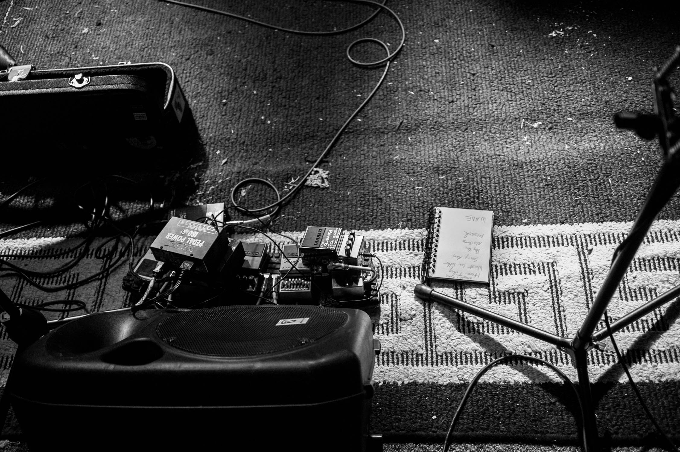 Effects pedals and a set list before a show at Avenue D.I.Y.