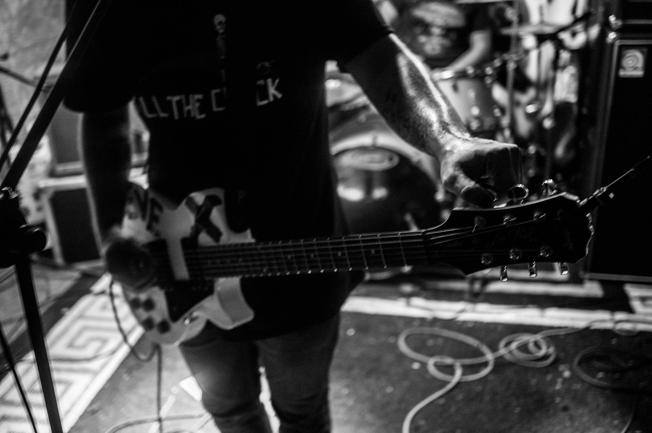 Tyler Reed tuning up during a Second Suitor set in Johnson City, NY