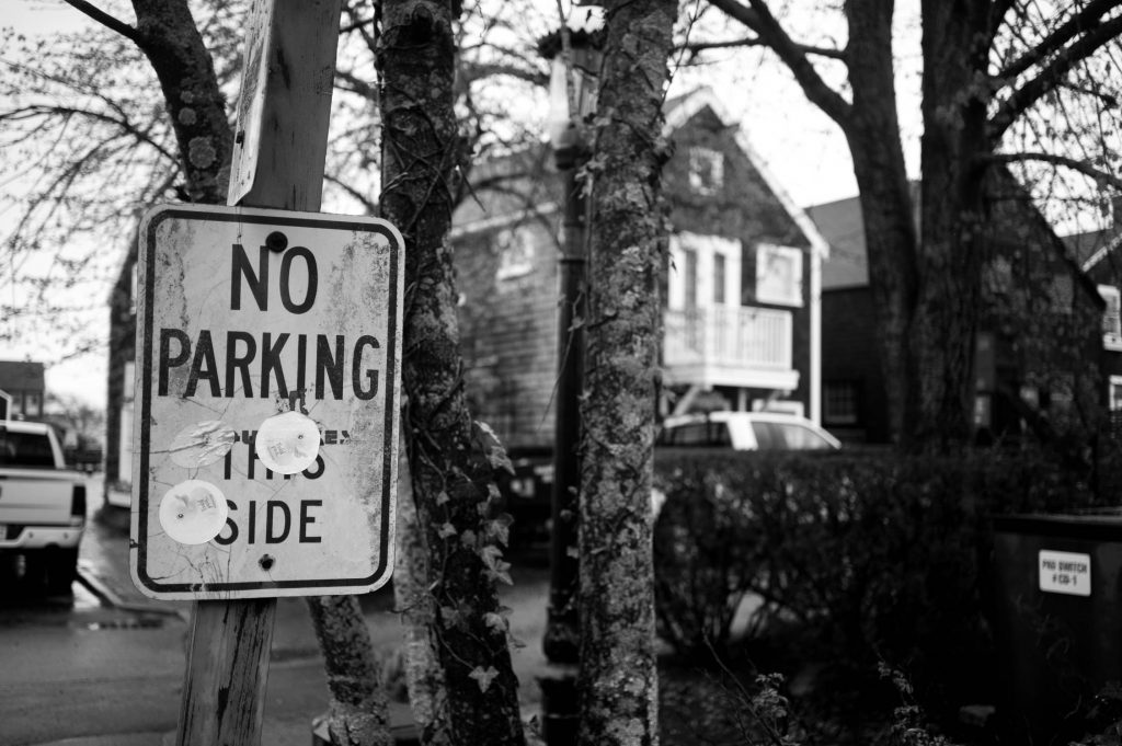 A "no parking" sign posted in the trees