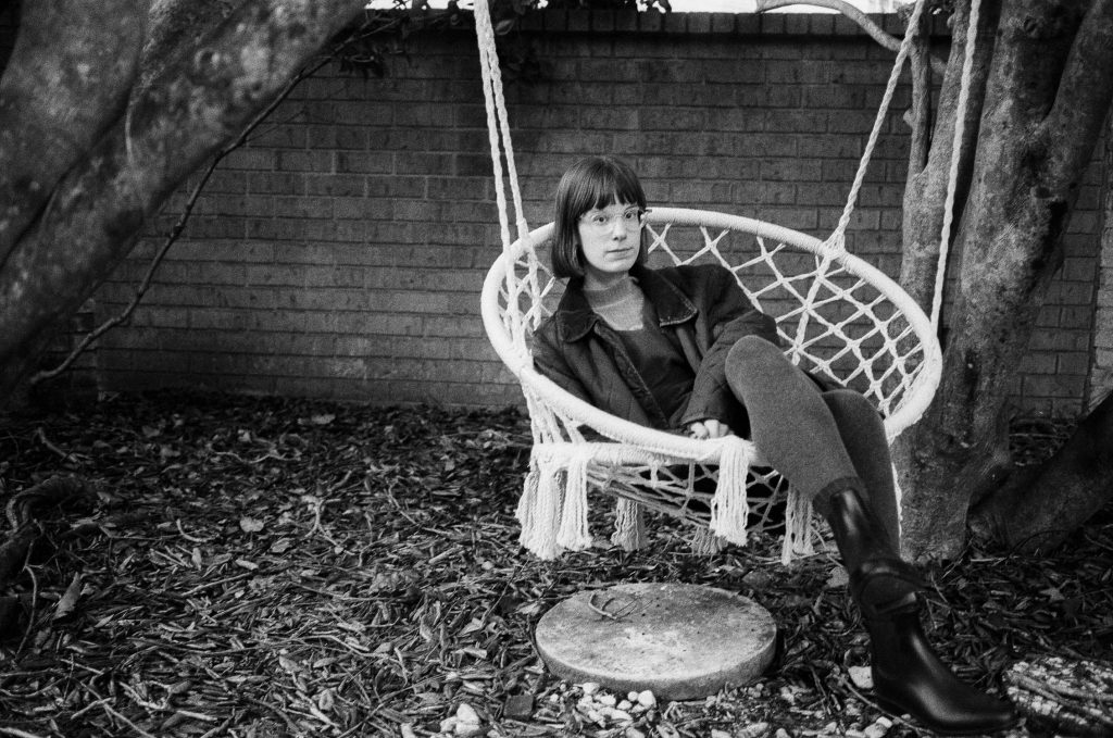 Michele sitting in a swing at our place to stay in Savannah