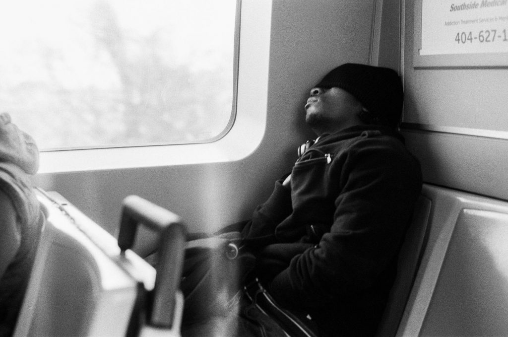 A man sleeping on a subway car in Atlanta, Georgia