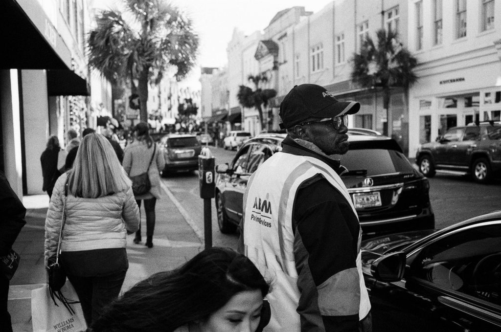 A woman ducking out of the way of a photograph in Charleston, South Carolina