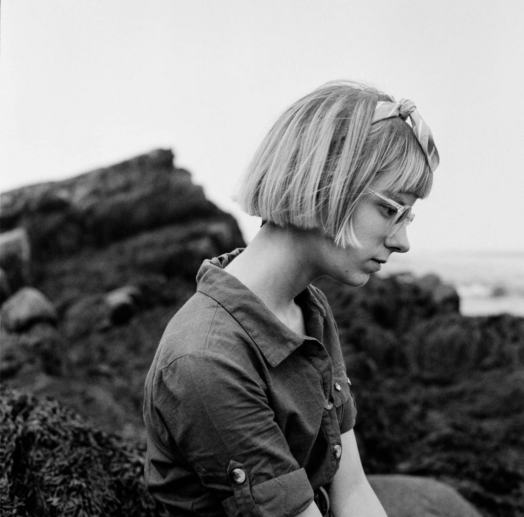 Michele on the rocks of Peaks Island, August 2021